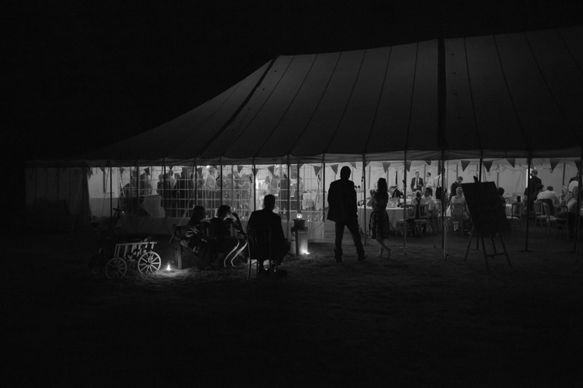 Dark night time shot of a large traditional marquee
