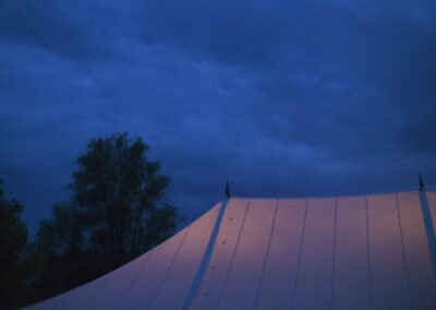 Night time, closeup exterior shot of a traditional marquee roof