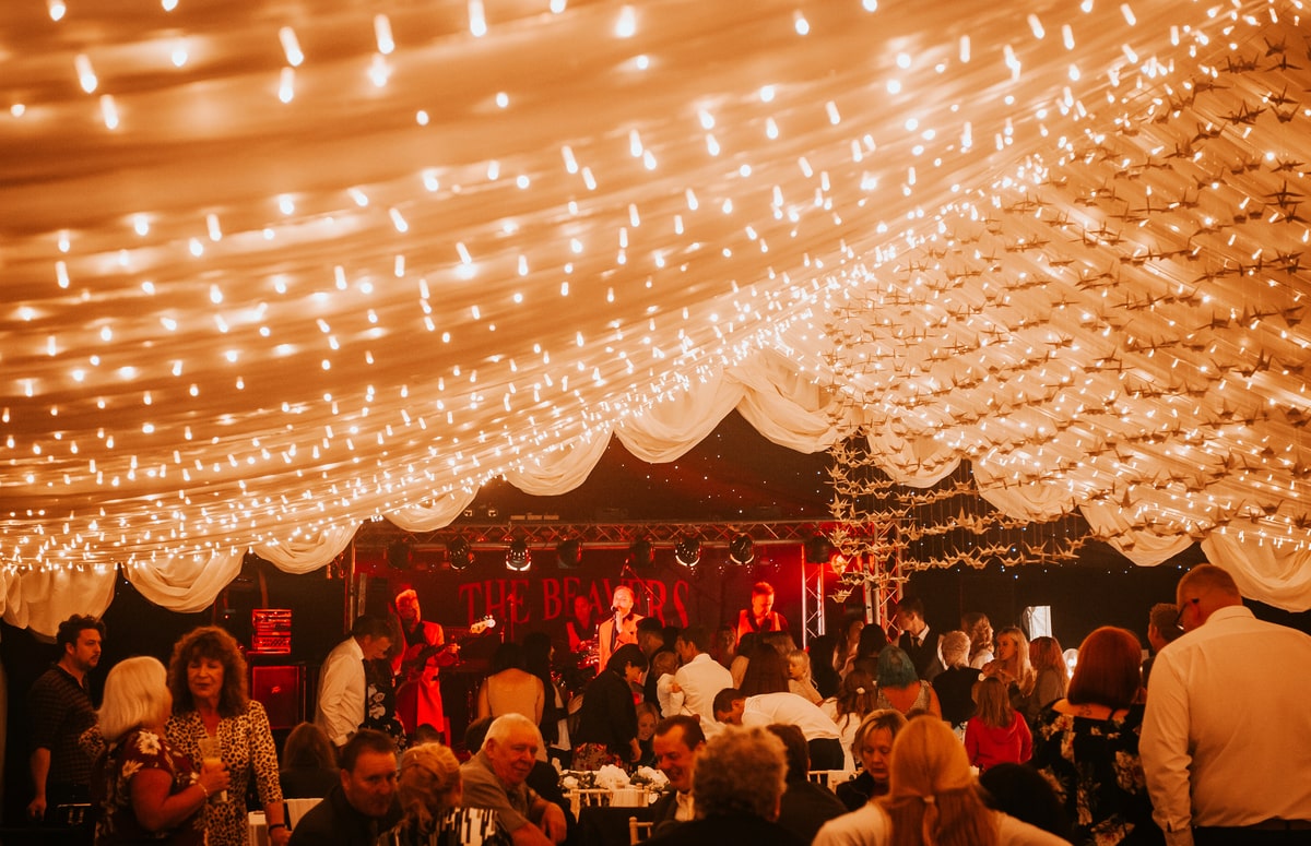 Band performing inside a wedding marquee | County Marquees East Anglia