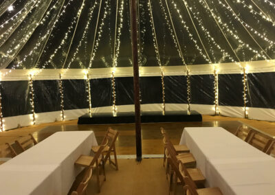 Interior shot of sail cloth marquee with festoon lighting