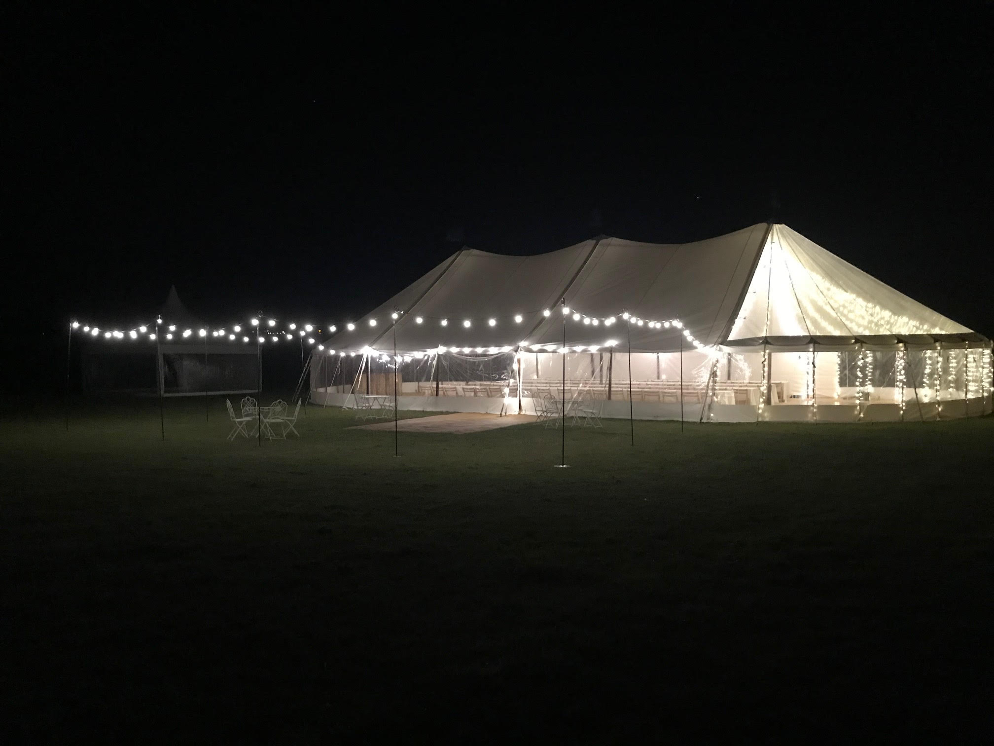 Sail cloth marquee with Festoon Light at night | County Marquees