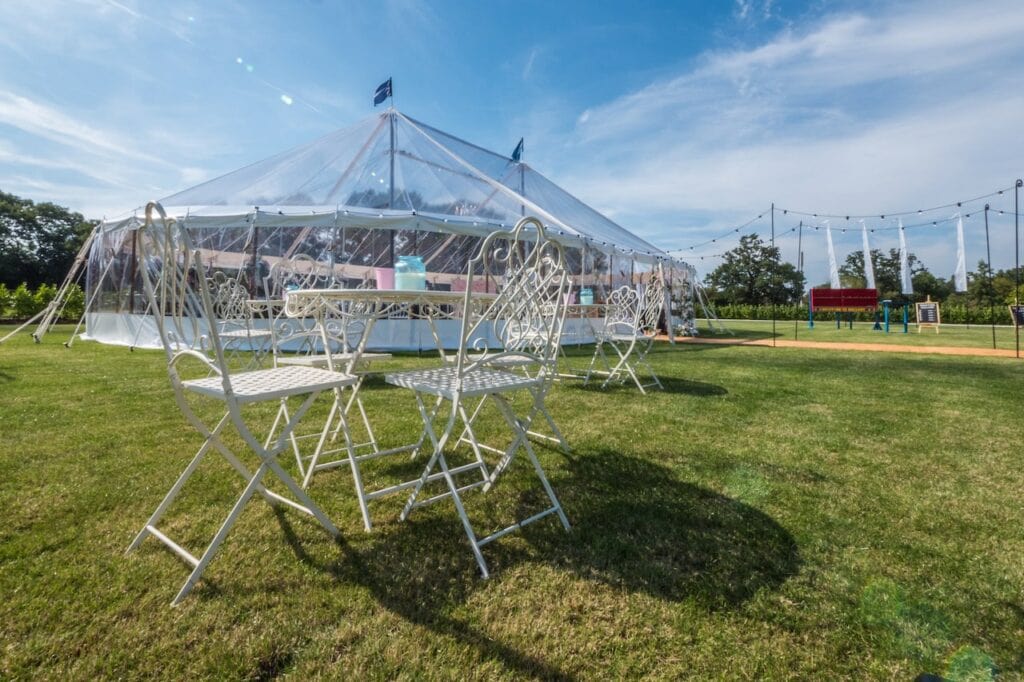 Marquee in field with chairs in front of it - marquee by County Marquees East Anglia who offer marquee rental