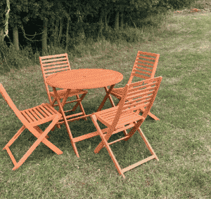 Wooden table and four chairs outside