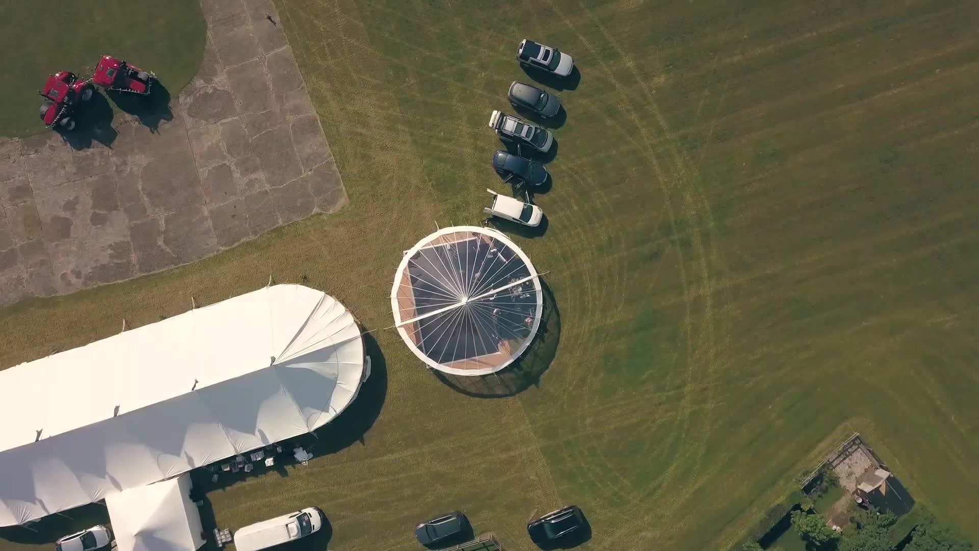 Festival marquee hire setup in East Anglia featuring a large clearspan marquee and circular event tent for outdoor festivals and events in Essex.
